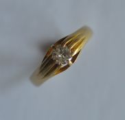 A heavy 18ct single stone diamond gypsy set ring in claw mount. Est. £150 - £200.