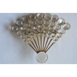 An attractive 18ct moonstone brooch in the form of an open fan. Est. £300 - £350.