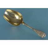 A Russian silver gilt caddy scoop. Est. £100 - £120