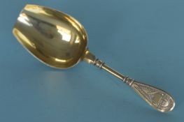 A Russian silver gilt caddy scoop. Est. £100 - £120