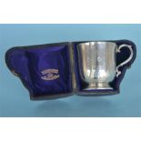 A boxed small Christening cup with gilt interior. London 1880. By R&S. Est. £150 - £200.