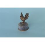 An attractive Russian silver gilt figure of a cockerel on grey agate circular base. Est. £450 - £