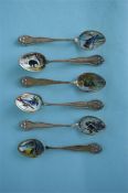 An attractive set of six sterling enamel decorated teaspoons with floral border. Est. £30 - £40