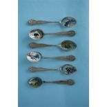 An attractive set of six sterling enamel decorated teaspoons with floral border. Est. £30 - £40