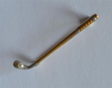 A good quality two colour brooch in the form of a golf club with pearl decoration. Approx. 4