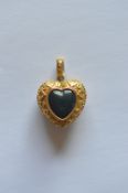 A good Georgian gold heart shaped vinaigrette with locket back, bloodstone front and loop top.