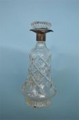 A silver and glass mounted decanter. Sheffield. 1929. By JAC. Est. £60 - £70