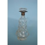 A silver and glass mounted decanter. Sheffield. 1929. By JAC. Est. £60 - £70