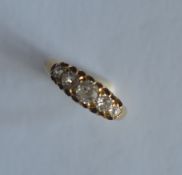 An 18ct diamond five stone boat shaped ring in claw mount. Est. £250 - £300.
