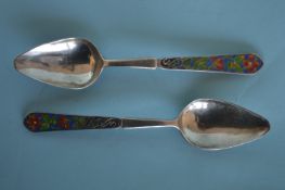 A pair of Bernard Instone enamel spoons. Est. £100 - £150
