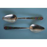 A pair of Bernard Instone enamel spoons. Est. £100 - £150