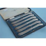 A set of six silver-bladed, pistol handled knives. Sheffield. By Walker & Hall. Est. £30- £40