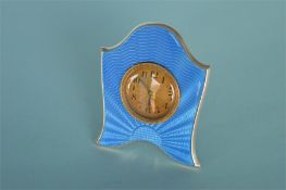 An attractive blue enamel bedside clock on bracket feet. Hallmarked to back under movement. Est. £