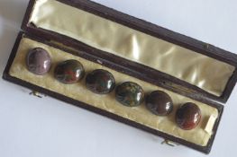 A boxed set of six bloodstone mounted buttons. Est. £20 - £30.