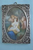 A good quality continental picture frame mounted with central miniature of semi-naked lady signed