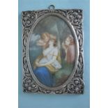 A good quality continental picture frame mounted with central miniature of semi-naked lady signed