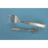 An MOP bread fork with engraved terminal together with one other. Est. £20 - £30