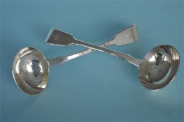 A pair of fiddle pattern sauce ladles with crested terminals. London 1854. By GA. Est. £100 - £120