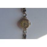 A lady's Tudor Royal wristwatch in 9ct case. Est. £60 - £80.