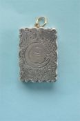 A heavy rectangular scroll engraved vinaigrette decorated with flowers and leaves, with loop top.