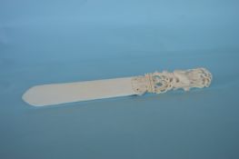 A good quality carved ivory paper knife mounted with a stag. Est. £150 - £200