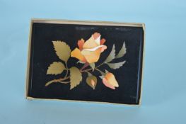 A good quality pietra dura paperweight in the form of a flower mounted with original label.
