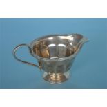 A silver paneled cream jug. Sheffield. By E.V. Approx. 140 grams. Est. £50 - £60