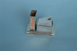 A large silver cigar cutter/vesta case with hinged top. Birmingham 1908. By M&M. Est. £150 - £200.