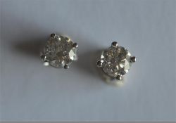 A good pair of diamond ear studs in white gold claw mount. Approx. 1.5 carats. Est. £1100 - £1200.