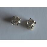 A good pair of diamond ear studs in white gold claw mount. Approx. 1.5 carats. Est. £1100 - £1200.