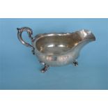 A good Georgian style large sauce boat with crested side and scroll feet. London 1848. By Hunt &