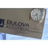 An unusual Bulova Accutron watch, series 218, date model. Complete with paperwork and guarantee.