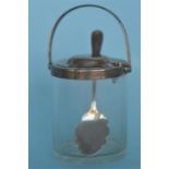An unusual swing handle preserve jar. Birmingham. 1931. By H. & H. Est. £60 - £80