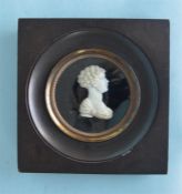 An unusual carved ivory framed bust of a Blackamore in wooden frame. Approx. 13cm Est. £250 - £300