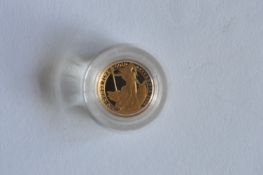 A proof Royal Mint £10 coin. Est. £60 - £70.