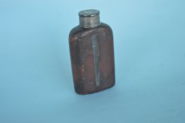 An unusual leather cased hip flask with tapered li