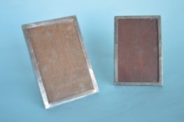 A rectangular silver mounted picture frame with pl