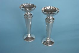 An attractive pair of vases with crimped rim and floral decoration on tapering supports. Approx.
