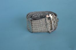 A heavy Continental mesh belt with pierced buckle.