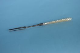 An unusual MOP toasting fork with three prongs. Bi