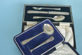 A cased christening set together with a spoon and