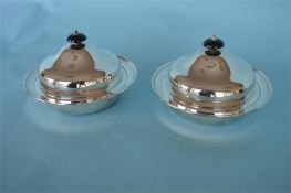 A pair of good muffin dishes with removable internal dishes. Sheffield. 1932. By E.V. Est. £500 - £