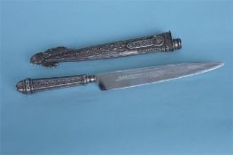 An American cased Sterling silver knife, heavily decorated with ranch scene. Approx. 30 cms long.