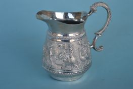 An Eastern silver cream jug, the body decorated wi