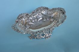 An attractive pierced and embossed sweet dish with