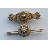 A small 9 carat enamel decorated target brooch. Approx. 5.8 grams, together with a gilt example.