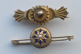 A small 9 carat enamel decorated target brooch. Approx. 5.8 grams, together with a gilt example.