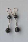 A pair of Victorian banded agate drop earrings on chain link suspension. Est. £140 - £160.