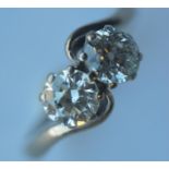 A good diamond two stone crossover ring in 18 carat white gold claw mount. Approx 2 carats. Est. £