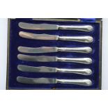 A boxed set of silver handled knives. Sheffield 19